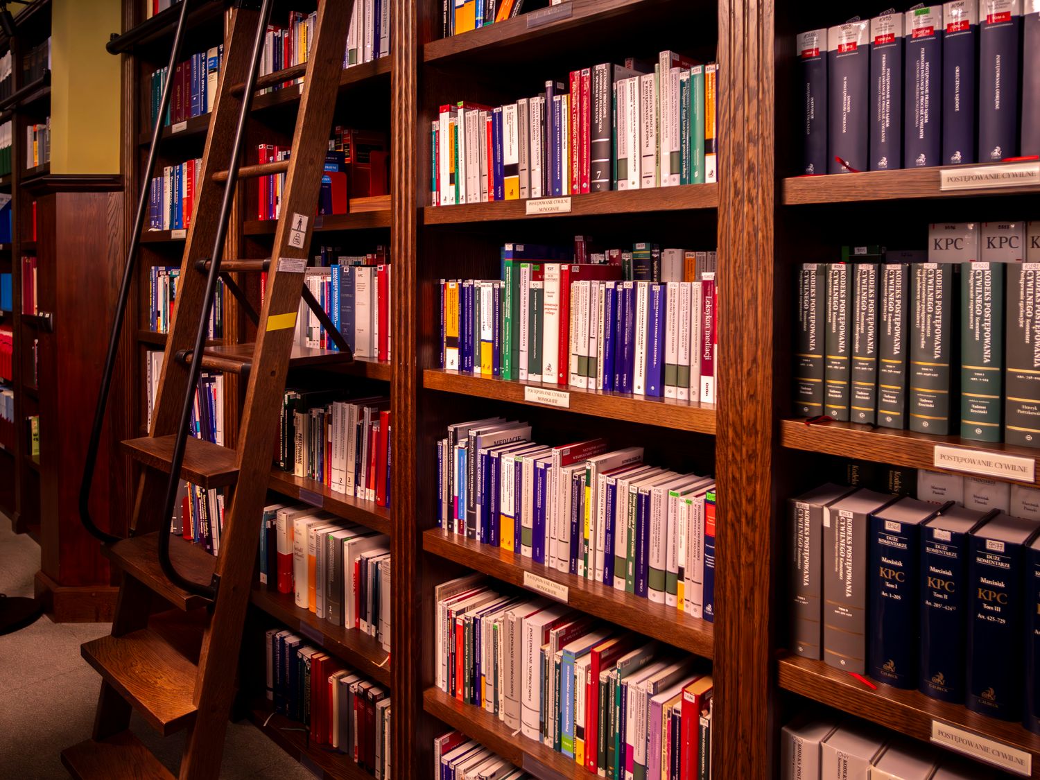 Shelves of law books in a quiet library.